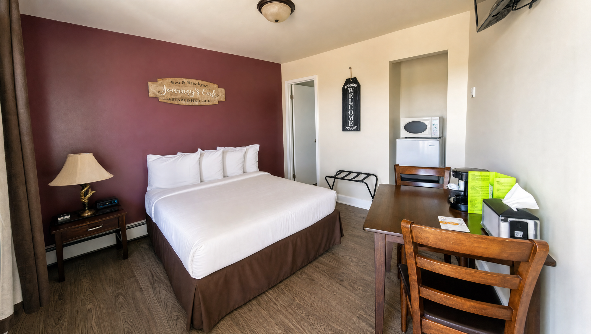 Clean, welcoming student lodging room with a packed bag